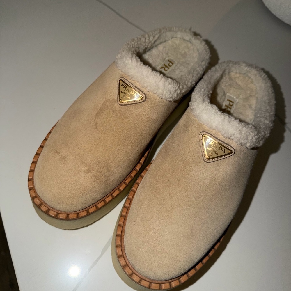 Prada Beige Suede Shearling Clogs with Gold Logo